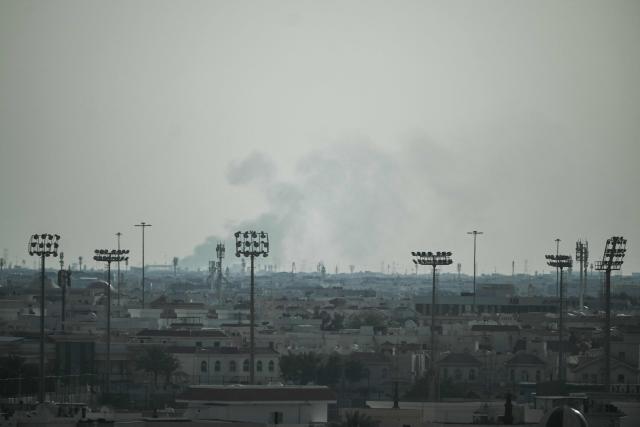 Smoke rises from an area in the direction of Al Udeid Air Base, which houses the Qatar Emiri Air Force and foreign forces including the US, in Doha on February 28, 2026, following a reported Iranian strike. The United States and Israel launched strikes against Iran on February 28, with Israel's public broadcaster reporting that supreme leader Ayatollah Ali Khamenei had been targeted, as the Islamic republic retaliated with barrages of missiles at Gulf states and Israel. (Photo by Mahmud HAMS / AFP)