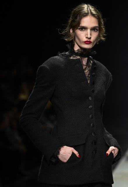 A model presents a creation for Dolce & Gabbana during the womens's ready-to-wear Fall/Winter 2026 collection fashion show as part of the Milan Fashion Week, in Milan on February 28, 2026. (Photo by Miguel MEDINA / AFP)