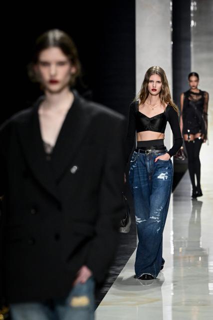 Models present creations for Dolce & Gabbana during the womens's ready-to-wear Fall/Winter 2026 collection fashion show as part of the Milan Fashion Week, in Milan on February 28, 2026. (Photo by Miguel MEDINA / AFP)