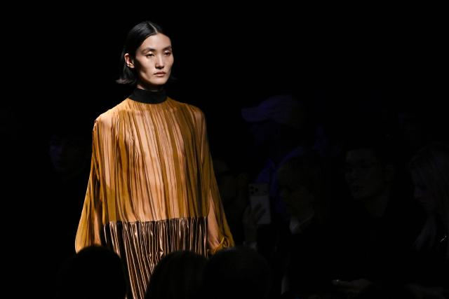 A model presents a creation for Ferragamo for the Women's Ready to Wear Fall/Winter 2026-2027 collection fashion show as part of the Milano Fashion Week, in Milan, northern Italy, on February 28, 2026. (Photo by Andreas SOLARO / AFP)