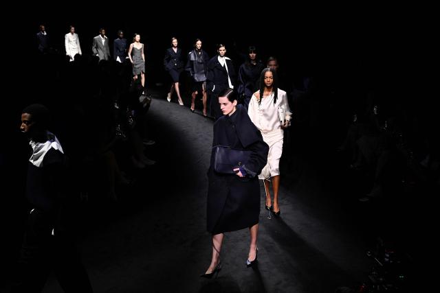 Models present creations for Ferragamo at the end of the Women's Ready to Wear Fall/Winter 2026-2027 collection fashion show as part of the Milano Fashion Week, in Milan, northern Italy, on February 28, 2026. (Photo by Andreas SOLARO / AFP)