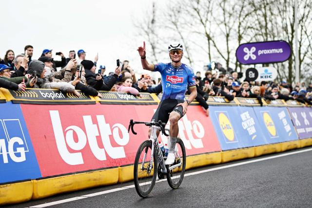 Netherlands' Mathieu van der Poel of Alpecin-Premier Tech celebrates as he wins the 81st edition of the men's one-day cycling race Omloop Het Nieuwsblad (UCI World Tour), the opening race of the Flemish one-day classics season, 207,6 km from Gent to Ninove on February 28, 2026. (Photo by MAARTEN STRAETEMANS / Belga / AFP) / Belgium OUT