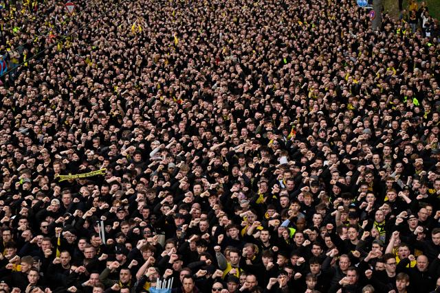 Dortmund fans take part in the fan march to the stadium for the German first division Bundesliga football match between BVB Borussia Dortmund and FC Bayern Munich in Dortmund, western Germany, on February 28, 2026. (Photo by INA FASSBENDER / AFP) / DFL REGULATIONS PROHIBIT ANY USE OF PHOTOGRAPHS AS IMAGE SEQUENCES AND/OR QUASI-VIDEO