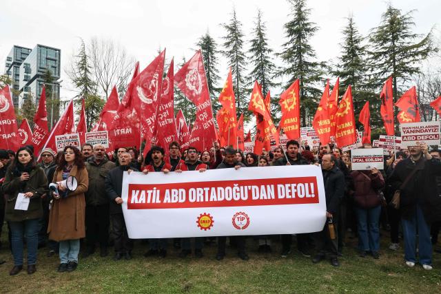 Protesters shout slogans and hold placard reading "Killer USA, get out of the Middle East!" during a demonstration in Ankara on February 28, 2026, following the US and Israel's strikes on Iran. The United States and Israel launched strikes against Iran on February 28, with Israel's public broadcaster reporting that the Iranian supreme leader had been targeted, as the Islamic republic retaliated with barrages of missiles at Gulf states and Israel. (Photo by ADEM ALTAN / AFP)
