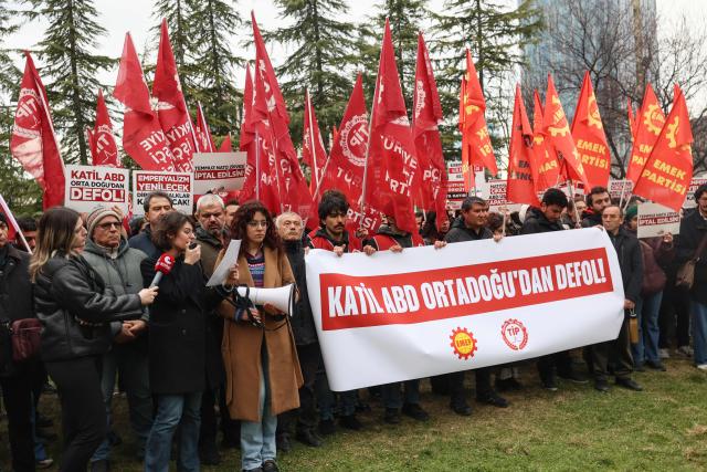 Protesters shout slogans and hold placard reading "Killer USA, get out of the Middle East!" during a demonstration in Ankara on February 28, 2026, following the US and Israel's strikes on Iran. The United States and Israel launched strikes against Iran on February 28, with Israel's public broadcaster reporting that the Iranian supreme leader had been targeted, as the Islamic republic retaliated with barrages of missiles at Gulf states and Israel. (Photo by ADEM ALTAN / AFP)