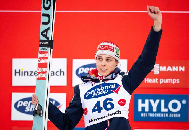 Austria's Lisa Eder celebrates on the podium after Women's Normal Hill HS90 competition at the FIS Ski Jumping World Cup in Hinzenbach, Austria, on February 28, 2026. Slovenia's Nika Prevc won the event ahead on Austria's Lisa Eder (2nd) and Norway's Anna Odine Stroem (3rd). (Photo by GEORG HOCHMUTH / APA / AFP) / Austria OUT