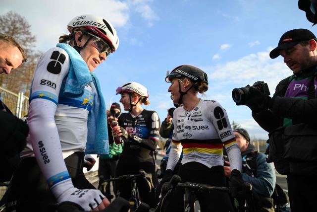 Winner Netherlands'  Demi Vollering of FDJ United (L) and Germany's Franziska Koch of FDJ United (C) celebrate after winning the women's  one-day cycling race Omloop Het Nieuwsblad (UCI World Tour), the opening race of the Flemish one-day classics season, 137,6 km from Gent to Ninove, on February 28, 2026. (Photo by DAVID PINTENS / Belga / AFP) / Belgium OUT
