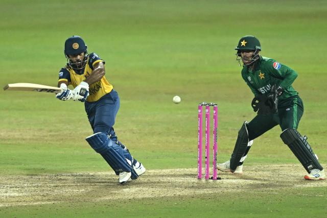 Sri Lanka's Pavan Rathnayake (L) plays a shot during the 2026 ICC Men's T20 Cricket World Cup Super Eights match between Sri Lanka and Pakistan at Pallekele International Cricket Stadium in Kandy on February 28, 2026. (Photo by R. Satish BABU / AFP)
