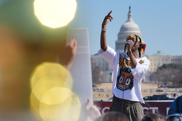 People take part in a "March 4 Democracy" protest in Washington, DC, on February 28, 2026. The United States and Israel launched what the latter called a "decisive and unprecedented" campaign against Iran, which retaliated with a barrage of missiles that sent residents running for cover on Saturday in cities across the Middle East. (Photo by Ken Cedeno / AFP)