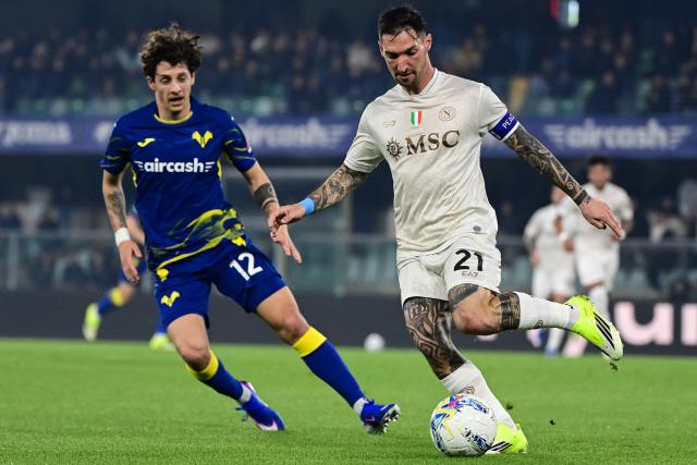 Hellas Verona's Croatian defender #12 Domagoj Bradaric (L) fights for the ball with Napoli's Italian forward #21 Matteo Politano during the Italian Serie A football match between Hellas Verona and Napoli at the Bentegodi Stadium in Verona, northern Italy, on February 28, 2026. (Photo by Piero CRUCIATTI / AFP)