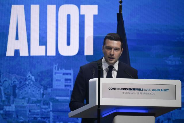 President of the far-right Rassemblement National (RN) party Jordan Bardella delivers a speech during a campaign rally of the RN Perpignan mayor and candidate for reelection ahead of France's municipal elections in Perpignan, southern France, on February 28, 2026. French voters head to the polls for municipal elections on March 15 and 22, 2026. (Photo by Ed JONES / AFP)