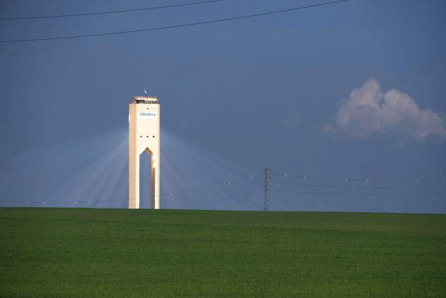 A picture taken on February 27, 2026 shows a solar power tower at Atlantica Yield solar plant in Sanlucar La Mayor. (Photo by Cristina Quicler / AFP)