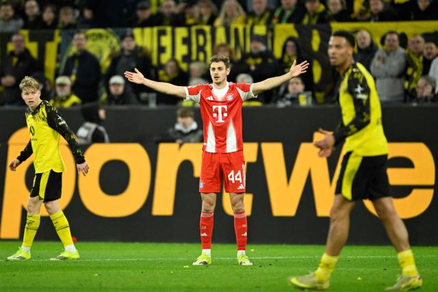 Bayern Munich's Croatian defender #44 Josip Stanisic (C) reacts during the German first division Bundesliga football match between BVB Borussia Dortmund and FC Bayern Munich in Dortmund, western Germany, on February 28, 2026. (Photo by INA FASSBENDER / AFP) / DFL REGULATIONS PROHIBIT ANY USE OF PHOTOGRAPHS AS IMAGE SEQUENCES AND/OR QUASI-VIDEO