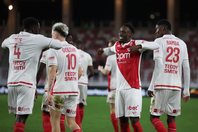 Monaco's US forward #09 Folarin Balogun (2ndR) celebrates with teammates after scoring his team's first goal during the French L1 football match between AS Monaco and SCO Angers at the Stade Louis II in the Principality of Monaco on February 28, 2026. (Photo by Valery HACHE / AFP)
