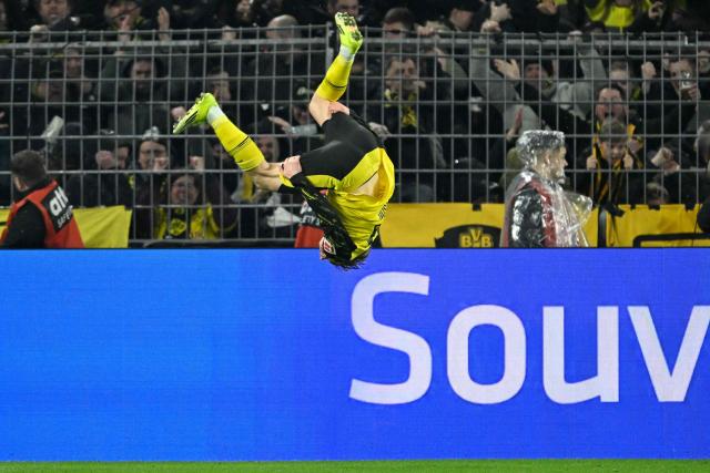 Dortmund's Swedish defender #24 Daniel Svensson celebrates scoring the 2-2 goal during the German first division Bundesliga football match between BVB Borussia Dortmund and FC Bayern Munich in Dortmund, western Germany, on February 28, 2026. (Photo by INA FASSBENDER / AFP) / DFL REGULATIONS PROHIBIT ANY USE OF PHOTOGRAPHS AS IMAGE SEQUENCES AND/OR QUASI-VIDEO