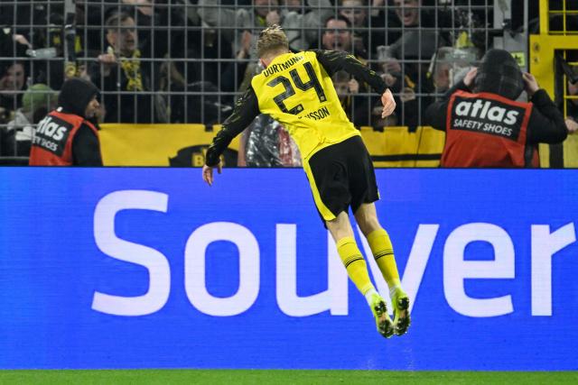 Dortmund's Swedish defender #24 Daniel Svensson celebrates scoring the 2-2 goal during the German first division Bundesliga football match between BVB Borussia Dortmund and FC Bayern Munich in Dortmund, western Germany, on February 28, 2026. (Photo by INA FASSBENDER / AFP) / DFL REGULATIONS PROHIBIT ANY USE OF PHOTOGRAPHS AS IMAGE SEQUENCES AND/OR QUASI-VIDEO