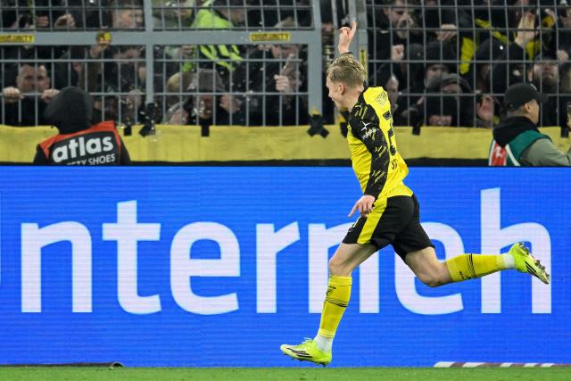 Dortmund's Swedish defender #24 Daniel Svensson celebrates scoring the 2-2 goal during the German first division Bundesliga football match between BVB Borussia Dortmund and FC Bayern Munich in Dortmund, western Germany, on February 28, 2026. (Photo by INA FASSBENDER / AFP) / DFL REGULATIONS PROHIBIT ANY USE OF PHOTOGRAPHS AS IMAGE SEQUENCES AND/OR QUASI-VIDEO