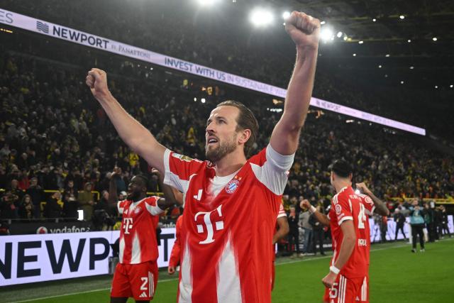 Bayern Munich players including Bayern Munich's English forward #09 Harry Kane celebrate with their fans after the German first division Bundesliga football match between BVB Borussia Dortmund and FC Bayern Munich in Dortmund, western Germany, on February 28, 2026. (Photo by INA FASSBENDER / AFP) / DFL REGULATIONS PROHIBIT ANY USE OF PHOTOGRAPHS AS IMAGE SEQUENCES AND/OR QUASI-VIDEO