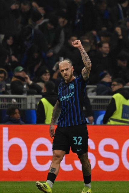 Inter Milan's Italian defender #32 Federico Dimarco celebrates after scoring his team's first goal during the Italian Serie A football match between Inter Milan and Genoa at the San Siro Stadium in Milan on February 28, 2026. (Photo by Andreas SOLARO / AFP)