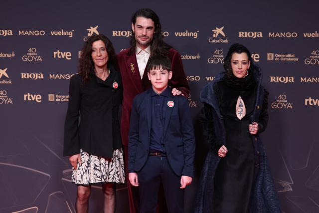 French-born Spanish director Oliver Laxe (2L) poses with actors Stefania Gadda (L), Bruno Nunez (3L) and Jade Oukid on the red carpet prior to the 40th Goya awards ceremony at the Auditori Forum CCIB in Barcelona, on February 28, 2026. (Photo by Josep LAGO / AFP)