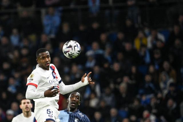 Paris Saint-Germain's Ecuadoran defender #51 Willian Pacho jumps to head the ball during the French L1 football match between Le Havre AC and Paris Saint-Germain (PSG) at the Stade Oceane in Le Havre, north-western France, on February 28, 2026. (Photo by JEAN-FRANCOIS MONIER / AFP)