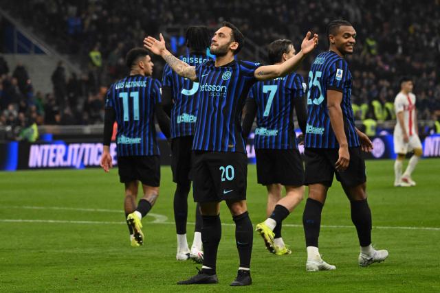 Inter Milan's Turkish midfielder #20 Hakan Calhanoglu celebrates after scoring his team's second goal in a penalty kick during the Italian Serie A football match between Inter Milan and Genoa at the San Siro Stadium in Milan on February 28, 2026. (Photo by Andreas SOLARO / AFP)