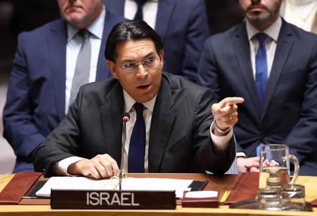 Permanent Representative of Israel to the UN Danny Danon points toward the Iranian delegation during a United Nations Security Council meeting on the situation in the Middle East at UN headquarters in New York on February 28, 2026. UN chief Antonio Guterres said military action in the Middle East "carries the risk of igniting a chain of events that no one can control". Gulf states condemned Iran's "cowardly" attacks in a joint statement read by Bahrain's ambassador during an emergency meeting of the UN Security Council (Photo by CHARLY TRIBALLEAU / AFP)