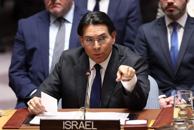 Permanent Representative of Israel to the UN Danny Danon points toward the Iranian delegation during a United Nations Security Council meeting on the situation in the Middle East at UN headquarters in New York on February 28, 2026. UN chief Antonio Guterres said military action in the Middle East "carries the risk of igniting a chain of events that no one can control". Gulf states condemned Iran's "cowardly" attacks in a joint statement read by Bahrain's ambassador during an emergency meeting of the UN Security Council (Photo by CHARLY TRIBALLEAU / AFP)