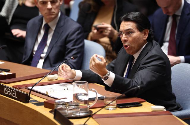 Permanent Representative of Israel to the UN Danny Danon gestures toward the Iranian delegation during a United Nations Security Council meeting on the situation in the Middle East at UN headquarters in New York on February 28, 2026. UN chief Antonio Guterres said military action in the Middle East "carries the risk of igniting a chain of events that no one can control". Gulf states condemned Iran's "cowardly" attacks in a joint statement read by Bahrain's ambassador during an emergency meeting of the UN Security Council (Photo by CHARLY TRIBALLEAU / AFP)