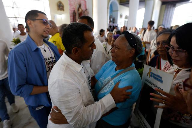 Former political prisoners and their relatives participate in a Mass for freedom in Maiquetia, La Guaira State, Venezuela, on February 28, 2026. (Photo by Pedro MATTEY / AFP)