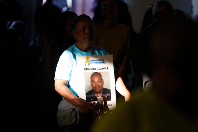 A woman, relative of a political prisoner, participates in a Mass for freedom in Maiquetia, La Guaira State, Venezuela, on February 28, 2026. (Photo by Pedro MATTEY / AFP)