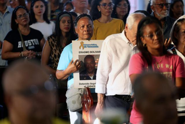 Relatives of political prisoners participate in a Mass for freedom in Maiquetia, La Guaira State, Venezuela, on February 28, 2026. (Photo by Pedro MATTEY / AFP)