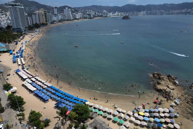 Aerial view of the Acapulco beach, Guerrero state, Mexico on February 28, 2026. (Photo by Alfredo ESTRELLA / AFP)