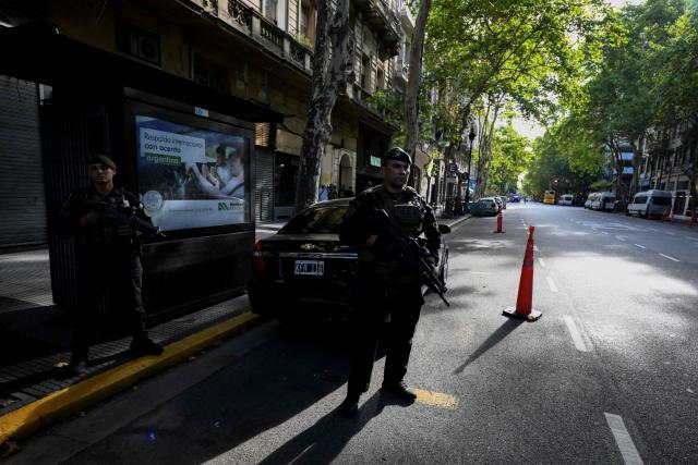 Members of Argentina's Special Forces police guard the Israel Embassy as part of heightened security in Buenos Aires on February 28, 2026. Argentina went on high alert on February 28 after the US and Israeli attacks on Iran and the latter's retaliatory strikes. The heightened alert in Argentina involves "all the country's sensitive targets, critical infrastructure and the Jewish community," President Javier Milei's office said in a statement. (Photo by Luis ROBAYO / AFP)