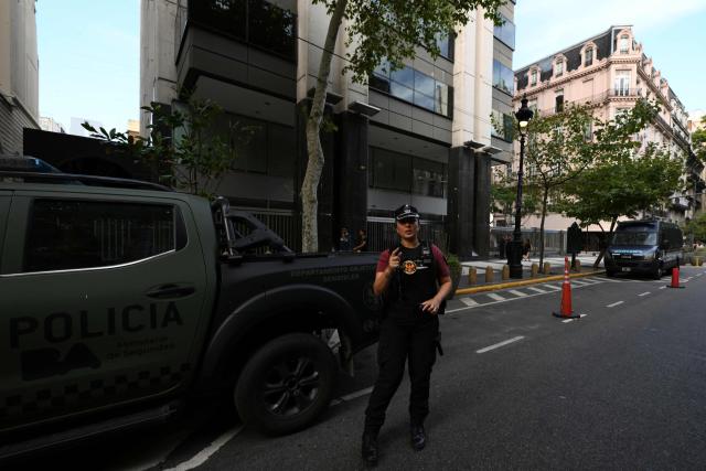 A member of Argentina’s Federal police guards the Israel Embassy as part of heightened security in Buenos Aires on February 28, 2026. Argentina went on high alert on February 28 after the US and Israeli attacks on Iran and the latter's retaliatory strikes. The heightened alert in Argentina involves "all the country's sensitive targets, critical infrastructure and the Jewish community," President Javier Milei's office said in a statement. (Photo by Luis ROBAYO / AFP)