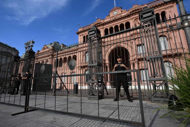 Members of Argentina’s federal police guard the presidential palace Casa Rosada as part of heightened security in Buenos Aires on February 28, 2026. Argentina went on high alert on February 28 after the US and Israeli attacks on Iran and the latter's retaliatory strikes. The heightened alert in Argentina involves "all the country's sensitive targets, critical infrastructure and the Jewish community," President Javier Milei's office said in a statement. (Photo by Luis ROBAYO / AFP)