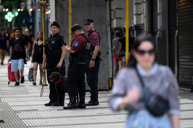 Members of Argentina's Special Forces police guard the Israel Embassy as part of heightened security in Buenos Aires on February 28, 2026. Argentina went on high alert on February 28 after the US and Israeli attacks on Iran and the latter's retaliatory strikes. The heightened alert in Argentina involves "all the country's sensitive targets, critical infrastructure and the Jewish community," President Javier Milei's office said in a statement. (Photo by Luis ROBAYO / AFP)