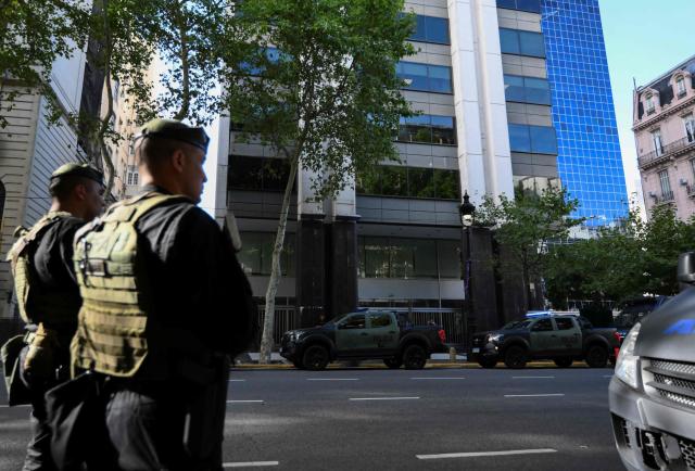 Members of Argentina's Special Forces police guard the Israel Embassy as part of heightened security in Buenos Aires on February 28, 2026. Argentina went on high alert on February 28 after the US and Israeli attacks on Iran and the latter's retaliatory strikes. The heightened alert in Argentina involves "all the country's sensitive targets, critical infrastructure and the Jewish community," President Javier Milei's office said in a statement. (Photo by Luis ROBAYO / AFP)