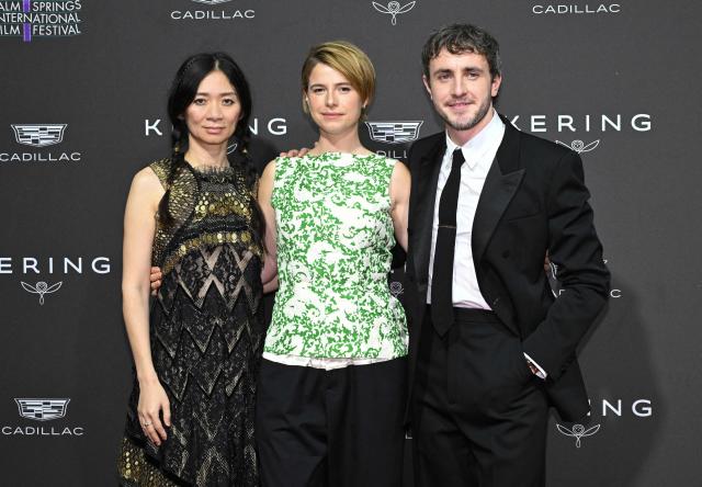 (FILES) (L/R) Chinese filmmaker Chloe Zhao, Irish actress Jessie Buckley and Irish actor Paul Mescal attend the Palm Springs International Film Festival Awards at the Palm Springs Convention Center in Palm Springs on January 3, 2026. If William Shakespeare were working today in film, he would want his movies shown in theaters instead of going straight to streaming, the Oscar-nominated producers of "Hamnet" say. With Hollywood's traditional business model roiled by the explosive growth of companies like Netflix in recent years, filmmakers are increasingly pushing back, urging studios to preserve the moviegoing experience. (Photo by Lisa O'CONNOR / AFP)
