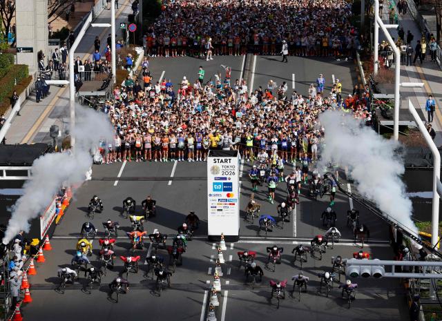Wheelchair athletes set off in front of the Tokyo Metropolitan Government building at the start of the Tokyo Marathon in the Shinjuku area of downtown Tokyo on March 1, 2026. (Photo by Franck ROBICHON / POOL / AFP)