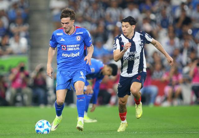 Cruz Azul's Argentine midfielder #08 Agustin Palavecino and Monterrey's defender #03 Gerardo Arteaga fight for the ball during the Liga MX Clausura tournament football match between Monterrey and Cruz Azul at BBVA Stadium in Monterrey, Mexico on February 28, 2026. (Photo by Julio Cesar AGUILAR / AFP)