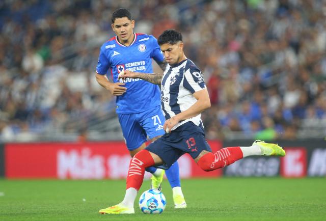 Cruz Azul's Uruguayan forward #21 Gabriel Fernandez and Monterrey's defender #13 Carlos Salcedo fight for the ball during the Liga MX Clausura tournament football match between Monterrey and Cruz Azul at BBVA Stadium in Monterrey, Mexico on February 28, 2026. (Photo by Julio Cesar AGUILAR / AFP)