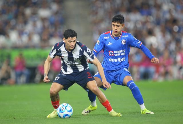 Monterrey's defender #03 Gerardo Arteaga (L) and Cruz Azul's defender #03 Omar Campos fight for the ball during the Liga MX Clausura tournament football match between Monterrey and Cruz Azul at BBVA Stadium in Monterrey, Mexico on February 28, 2026. (Photo by Julio Cesar AGUILAR / AFP)