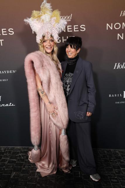 (FILES) US singer-songwriter Kesha and US songwriter Diane Warren (R) arrive to The Hollywood Reporter's Nominees Night held at Chateau Marmont in Los Angeles, on February 10, 2026. Diane Warren has become something of a fixture at Hollywood's annual Oscars ceremony. The American songwriter has been nominated 17 times for best original song starting in 1987, including each of the last nine years. Warren says her entry for the 98th Academy Awards is a letter of love and empowerment to her bullied younger self. Performed by Kesha, "Dear Me" is part of the soundtrack to "Diane Warren: Relentless," a documentary about her life and career. (Photo by Michael Tran / AFP)