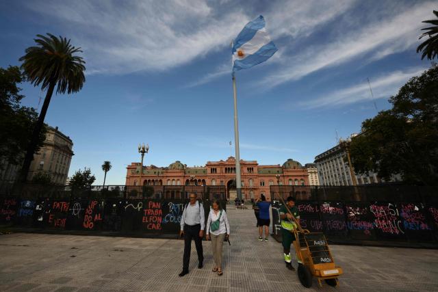 People walk at Plaza de Mayo square in front of presidential palace Casa Rosada in Buenos Aires on February 28, 2026. Argentina went on high alert on February 28 after the US and Israeli attacks on Iran and the latter's retaliatory strikes. The heightened alert in Argentina involves "all the country's sensitive targets, critical infrastructure and the Jewish community," President Javier Milei's office said in a statement. (Photo by Luis ROBAYO / AFP)