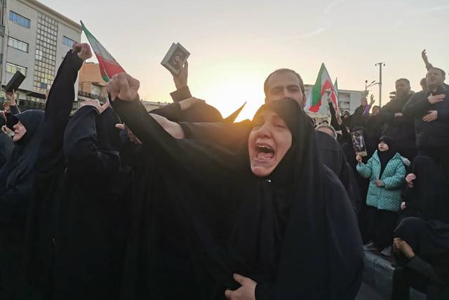TOPSHOT - People mourn the death of Iran’s Supreme Leader Ayatollah Ali Khamenei, who was killed in joint US and Israeli strikes, in Tehran on March 1, 2026. Ayatollah Ali Khamenei, Iran's supreme leader since 1989 and sworn enemy of the West, was killed in the opening salvo of a massive US and Israeli attack that extended into a second day on March 1, as the two powers seek to topple the Islamic republic. (Photo by Atta KENARE / AFP)