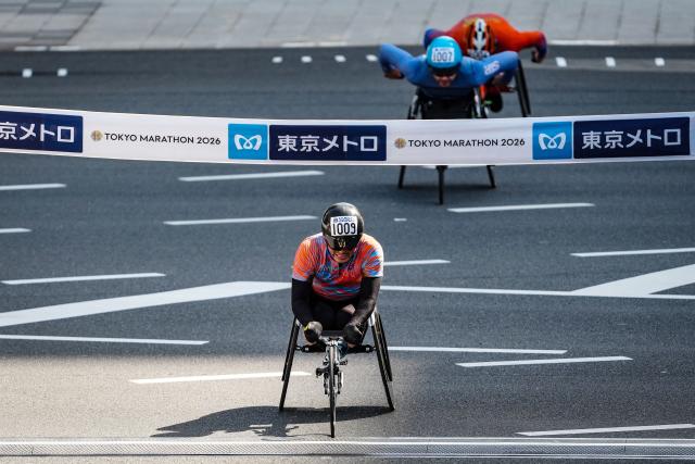 Japan’s Sho Watanabe finishes in third place in the men's wheelchair category of the Tokyo Marathon in downtown Tokyo on March 1, 2026. (Photo by JIA HAOCHENG / POOL / AFP)