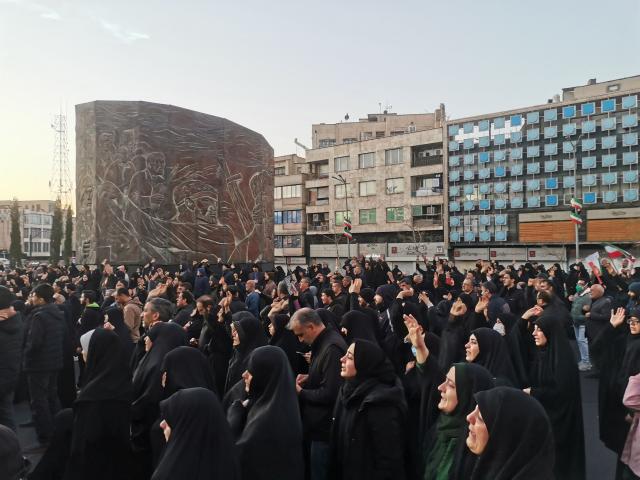 TOPSHOT - People gather on the street to mourn the death of Iran’s Supreme Leader Ayatollah Ali Khamenei, who was killed in joint US and Israeli strikes, in Tehran on March 1, 2026. Ayatollah Ali Khamenei, Iran's supreme leader since 1989 and sworn enemy of the West, was killed in the opening salvo of a massive US and Israeli attack that extended into a second day on March 1, as the two powers seek to topple the Islamic republic. (Photo by Atta KENARE / AFP)