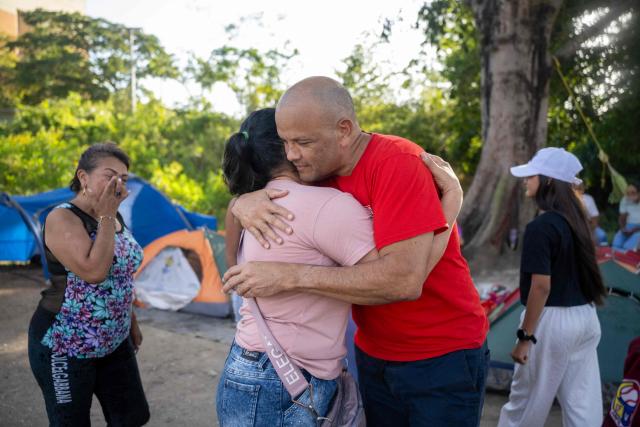 Retired lieutenant colonel of the Venezuelan Air Force and prisoner Rodolfo Polo embraces a relative after being released from El Rodeo I prison in Guatire, Miranda state, Venezuela on February 28, 2026. Venezuela granted parole to 31 military officers on February 28, reported a lawmaker who is monitoring the “reconciliation” process promoted by the interim government, which includes a historic amnesty law that was just enacted. (Photo by Maryorin Mendez / AFP)
