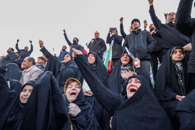 People mourn the death of Iran’s supreme leader Ayatollah Ali Khamenei, who was killed in joint US and Israeli strikes, at a square in Tehran on March 1, 2026. Ayatollah Ali Khamenei, Iran's supreme leader since 1989 and sworn enemy of the West, was killed in the opening salvo of a massive US and Israeli attack that extended into a second day on March 1, as the two powers seek to topple the Islamic republic. (Photo by ATTA KENARE / AFP)